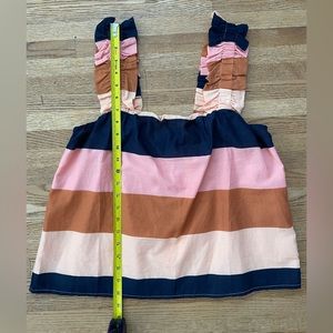 Women’s sleeveless striped top with cute button back